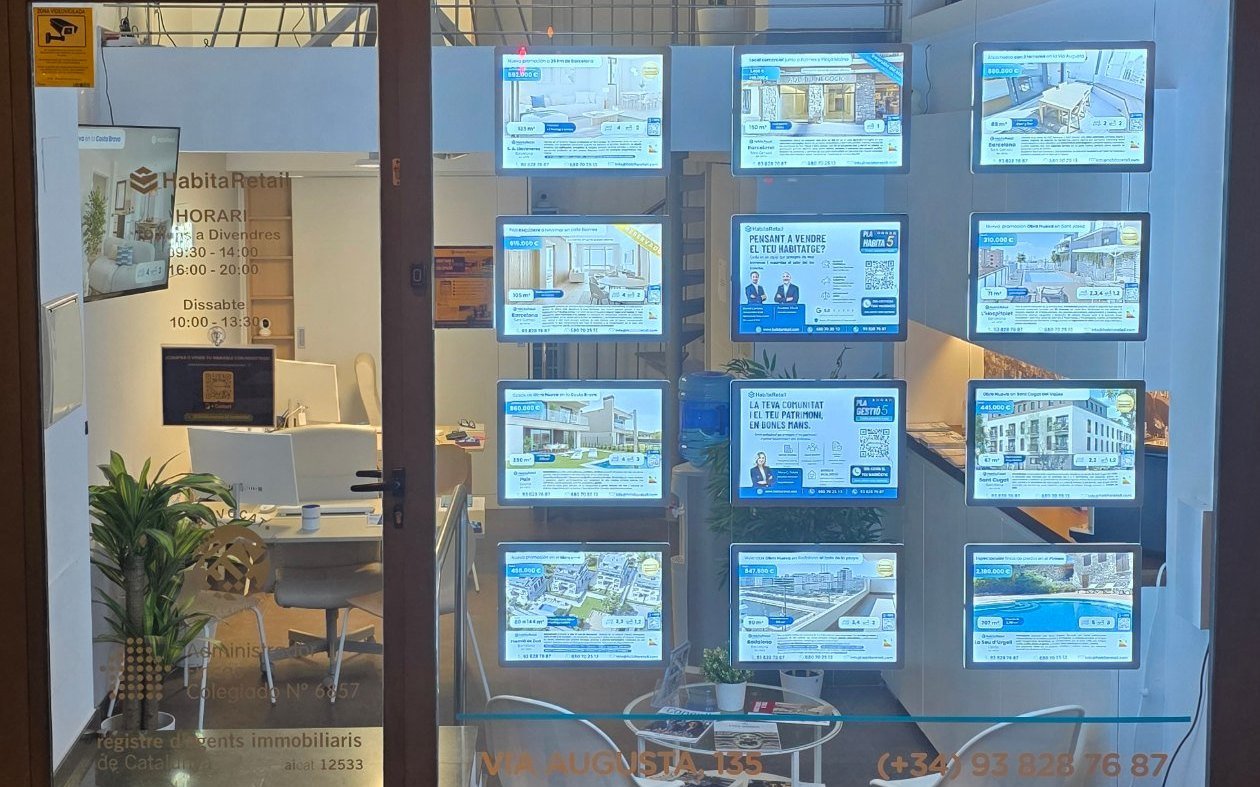 HabitaRetail’s shop window on Via Augusta displaying new-build developments